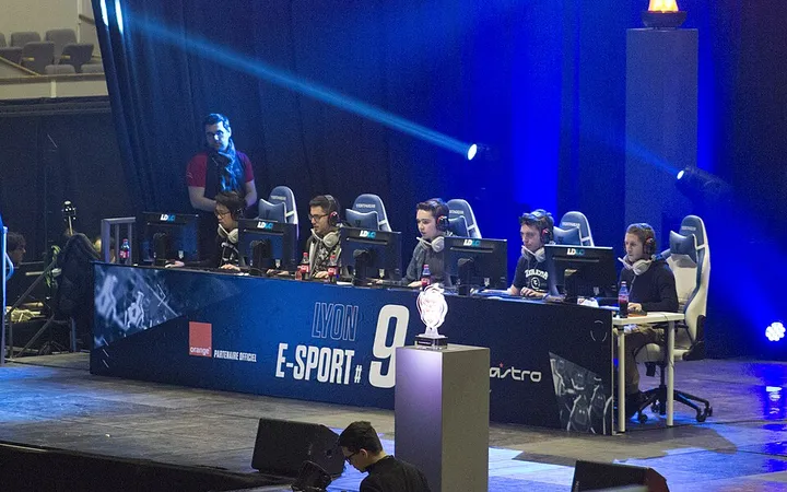 Esports team playing on stage at Lyon Esport