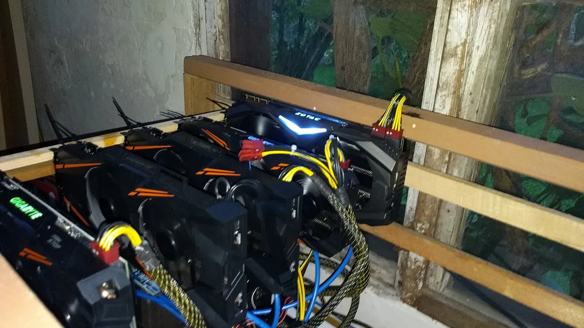 Open-frame GPU cryptocurrency mining rig with several graphics cards