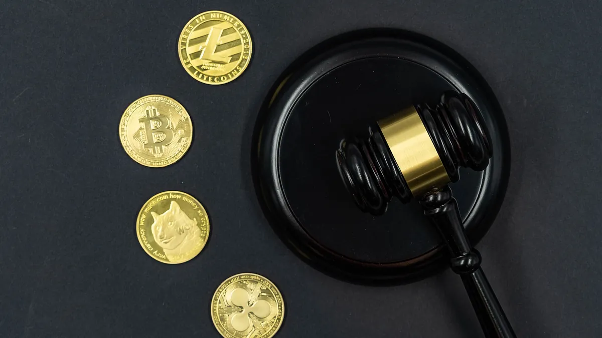Gold coins next to a judge’s gavel