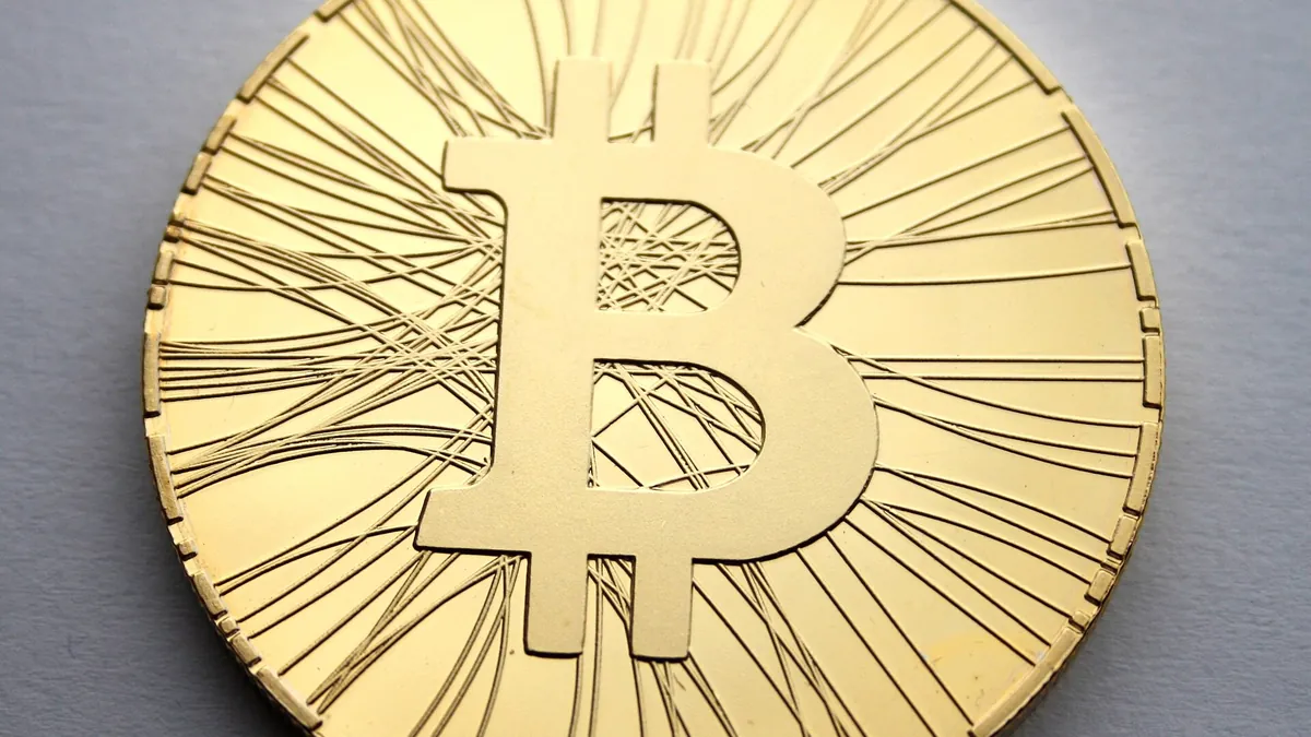 Close-up of a gold physical bitcoin coin